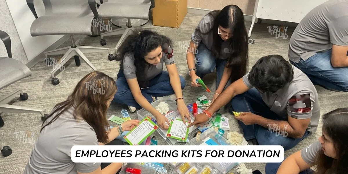 Employees packing kits for donation
